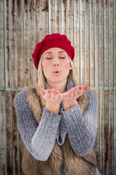 Blonde in winter clothes with hands out — Stock Photo, Image