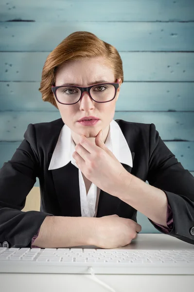 Thinking redhead businesswoman — Stock Photo, Image