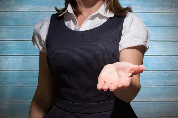 Businesswoman presenting against wooden planks — Stock Photo, Image