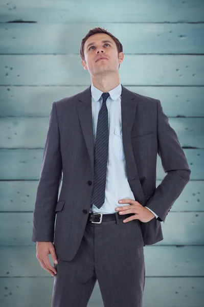 Serious businessman with hand on hip — Stock Photo, Image