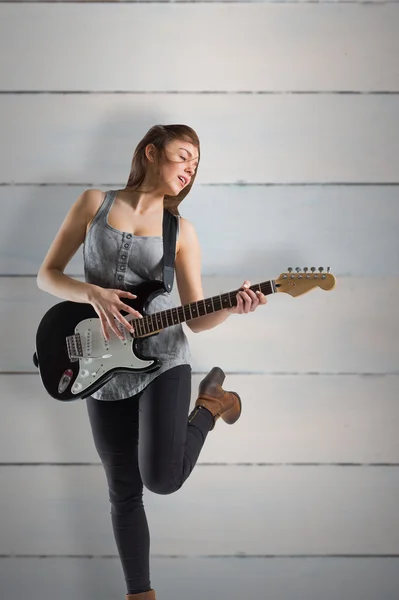 Pretty young girl playing her guitar — Stock Photo, Image