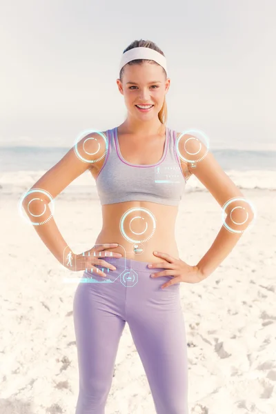 Sporty blonde on the beach smiling — Stock Photo, Image
