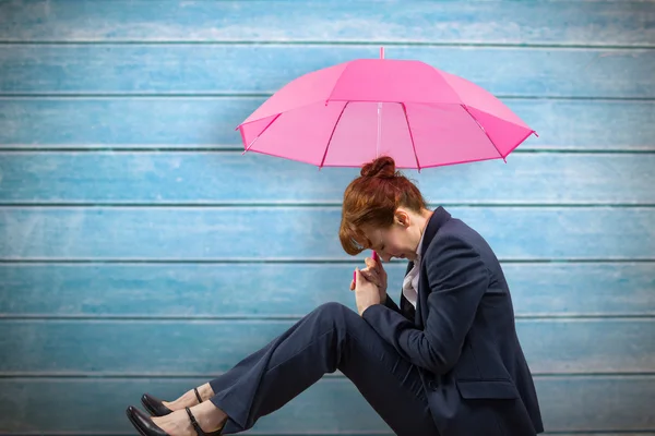 Businesswoman with umbrella — Stock Photo, Image