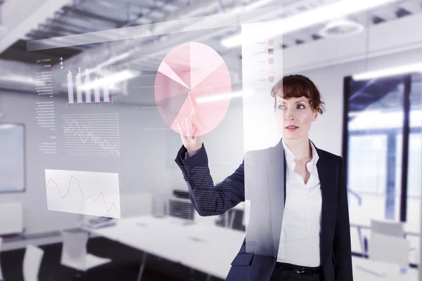 Composite image of businesswoman pointing — Stock Photo, Image