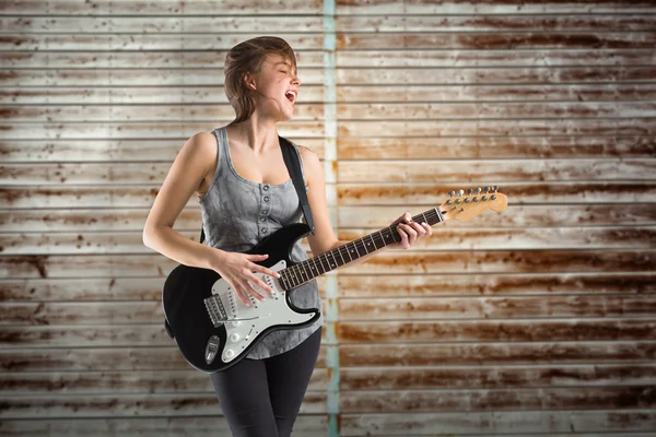 Pretty young girl playing guitar — Stock Photo, Image