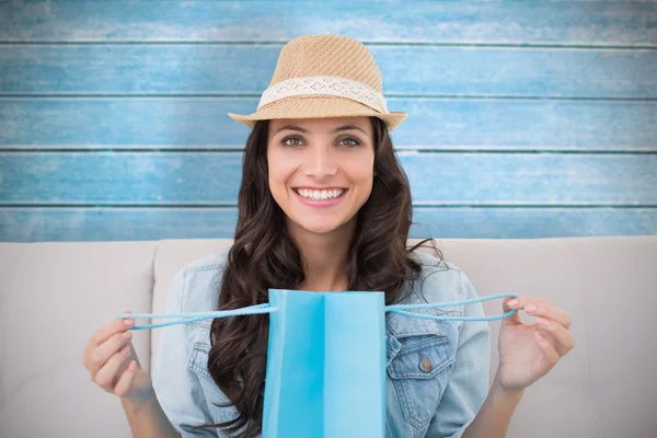 Brunette with shopping bag — Stock Photo, Image