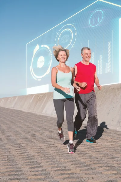 Active senior couple out for a jog — Stock Photo, Image