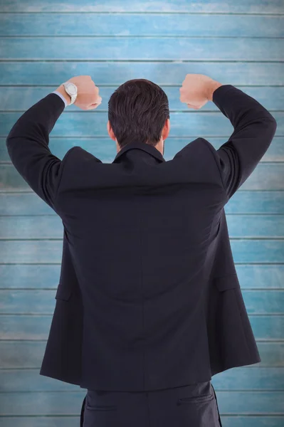 Businessman standing with arms raised — Stock Photo, Image