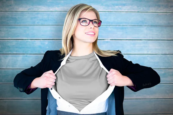 Businesswoman opening shirt in superhero style — Stock Photo, Image