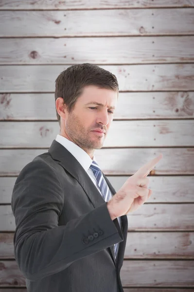 Businessman standing and pointing the finger — Stock Photo, Image