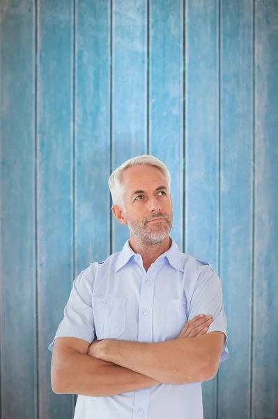 Thinking man posing with arms crossed — Stock Photo, Image
