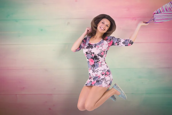 Excited brunette jumping — Stock Photo, Image