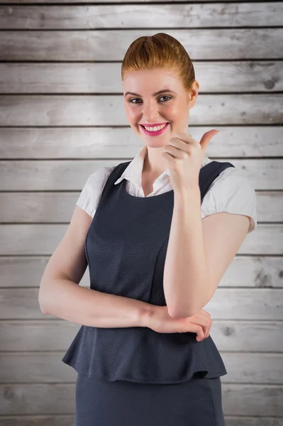 Redhead businesswoman showing thumbs up — Stock Photo, Image
