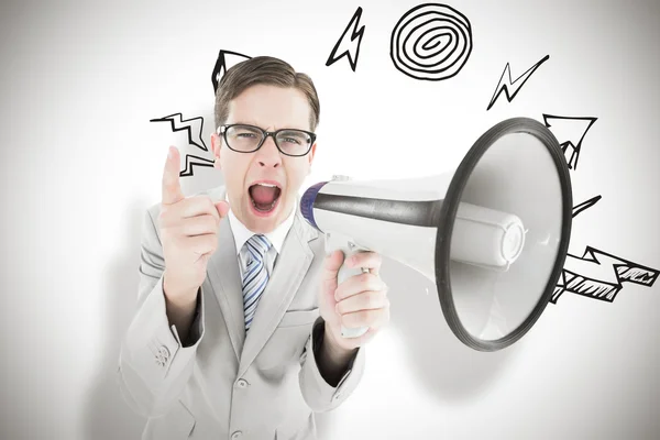 Businessman shouting through megaphone — Stock Photo, Image