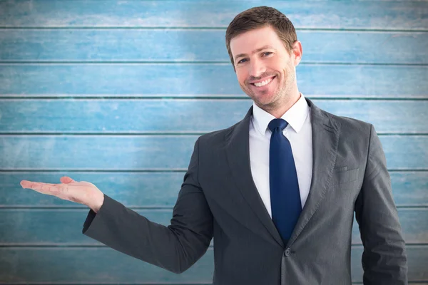 Businessman with his hand out — Stock Photo, Image