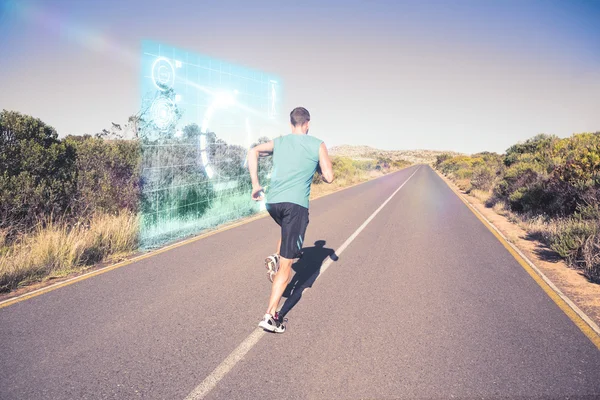 Ajuste homem correndo na estrada aberta — Fotografia de Stock