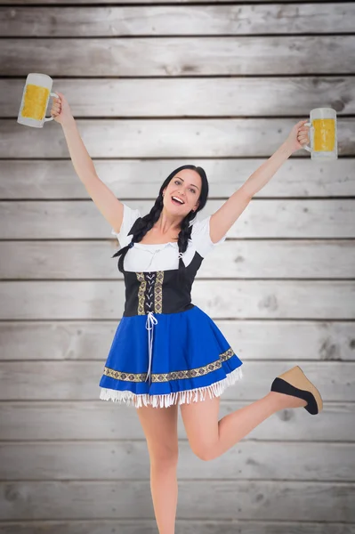 Oktoberfest girl holding beer tankards — Stock Photo, Image