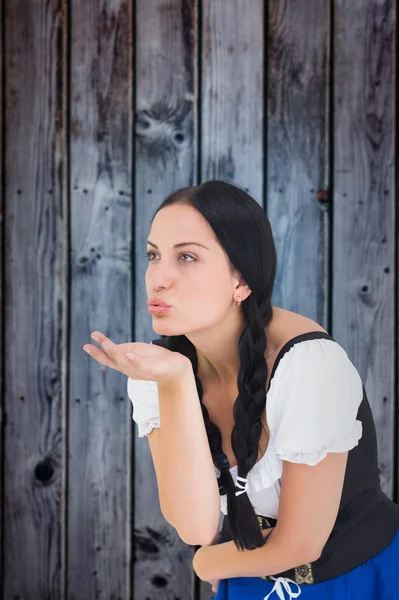 Pretty oktoberfest girl blowing a kiss — Stock Photo, Image