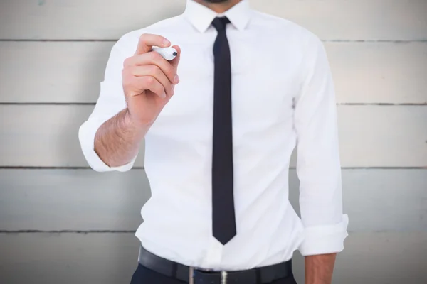 Focused businessman writing with marker — Stock Photo, Image