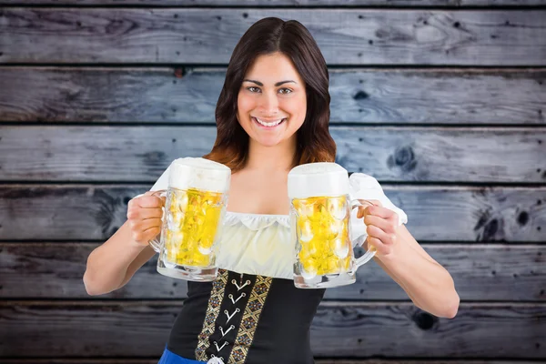 Oktoberfest girl holding beer tankards — Stock Photo, Image