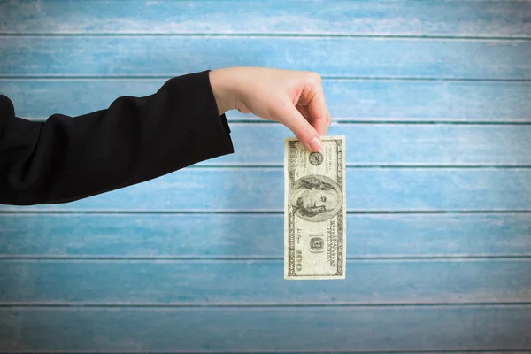 Businesswomans hand holding hundred dollar bill — Stock Photo, Image