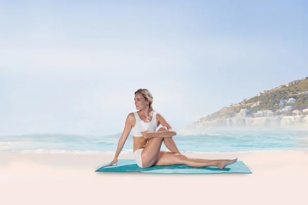 Fit blonde in seated yoga pose — Stock Photo, Image