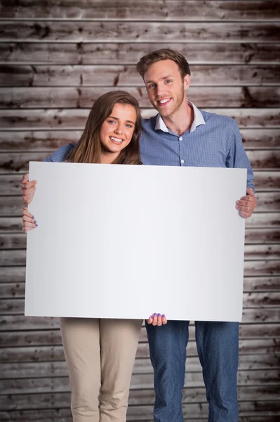 Couple with blank board — Stock Photo, Image