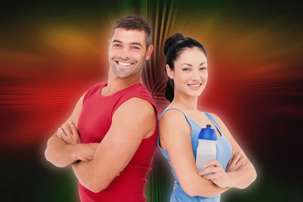 Fit man and woman smiling — Stock Photo, Image