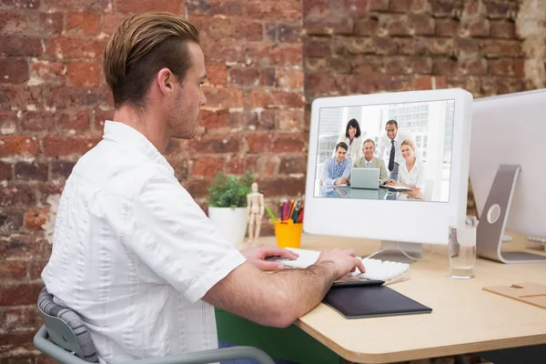 Business people gathered around laptop — Stock Photo, Image