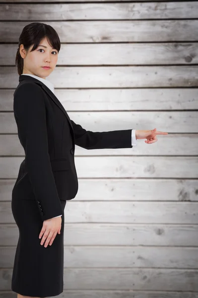 Focused businesswoman pointing — Stock Photo, Image