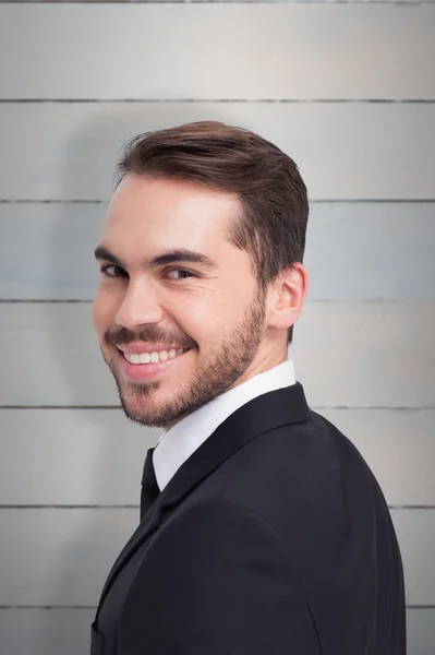 Businessman in suit smiling at camera — Stock Photo, Image