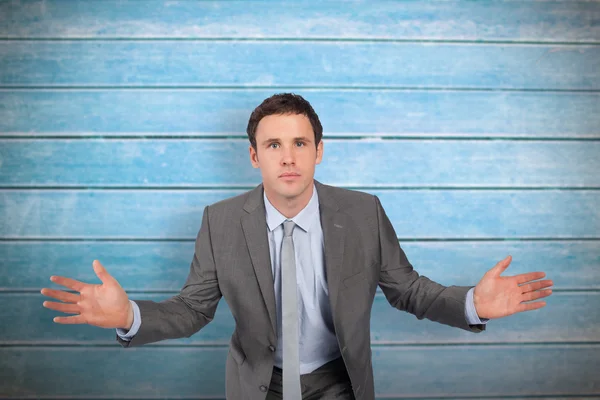 Businessman posing with hands out — Stock Photo, Image