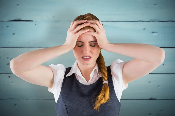 Stressed businesswoman with hands on head — Stock Photo, Image