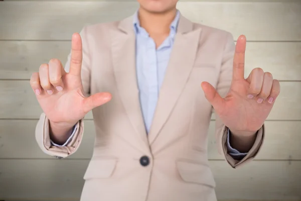 Businesswoman touching against wooden planks — Stock Photo, Image