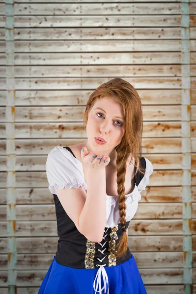 Oktoberfest girl blowing a kiss — Stock Photo, Image