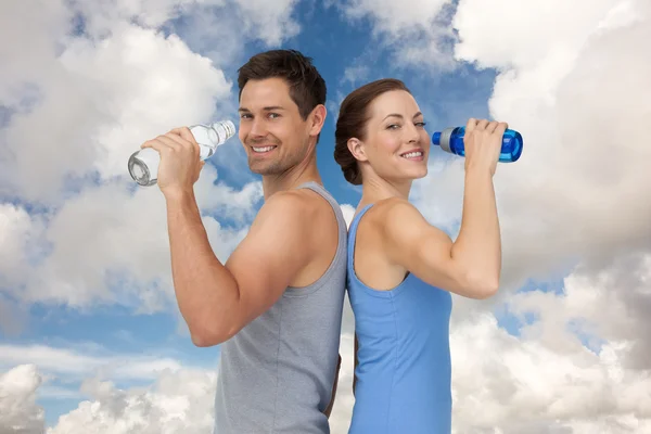 Couple with water bottles — Stock Photo, Image