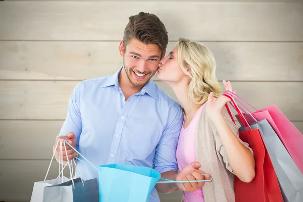 Couple holding shopping bags Stock Image