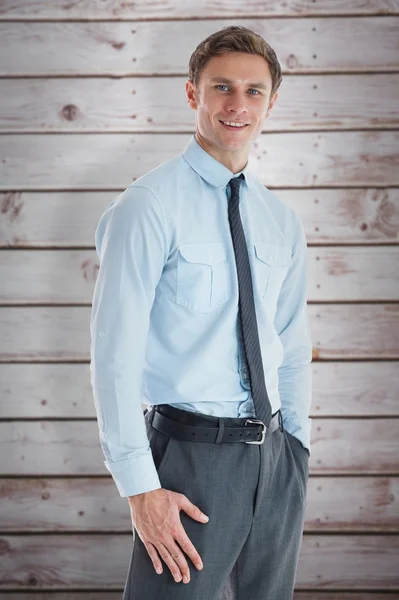 Businessman standing with hand in pocket — Stock Photo, Image