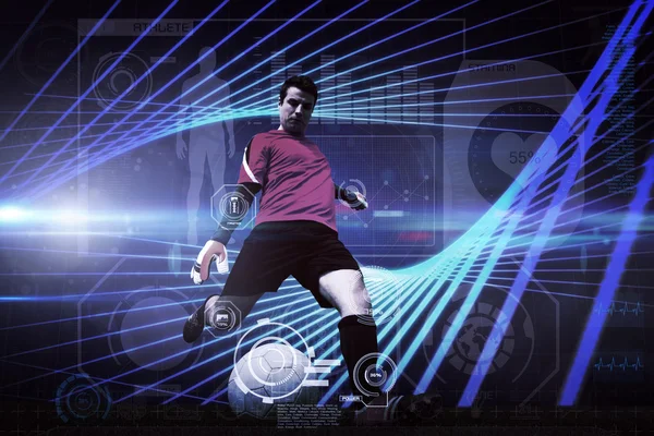 Composite image of goalkeeper kicking ball — Stock Photo, Image