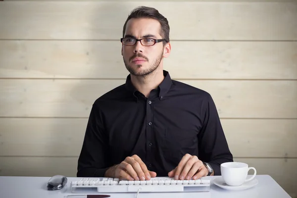 Focused businessman with glasses using computer — Stock Photo, Image