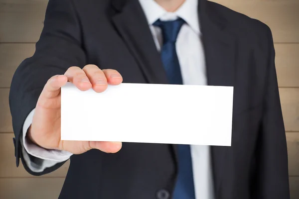 Mature businessman showing card — Stock Photo, Image