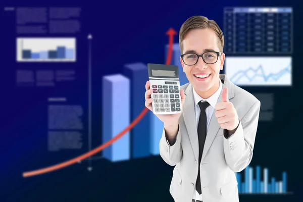 Geeky smiling businessman showing calculator — Stock Photo, Image