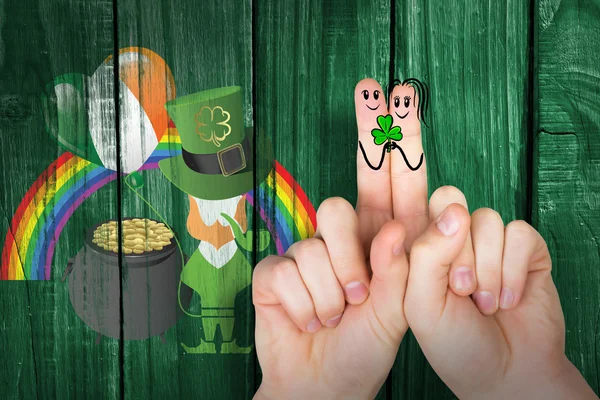 Composite image of patricks day fingers — Stock Photo, Image