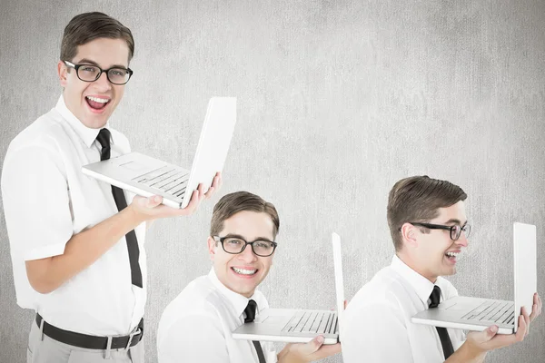 Composite image of nerd with laptop — Stock Photo, Image