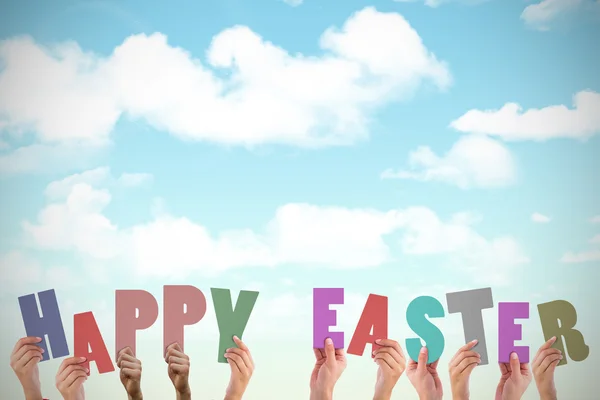 Hands holding up happy easter — Stock Photo, Image
