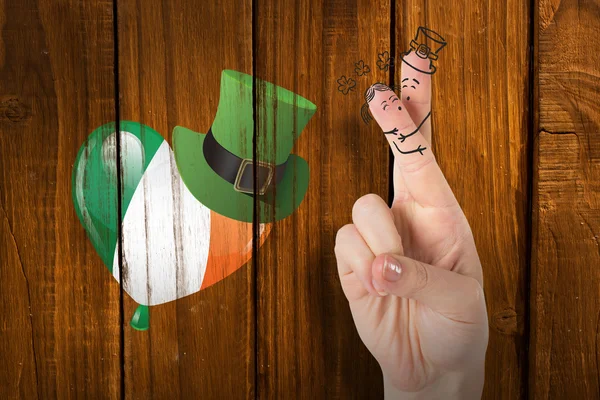 Composite image of patricks day fingers — Stock Photo, Image