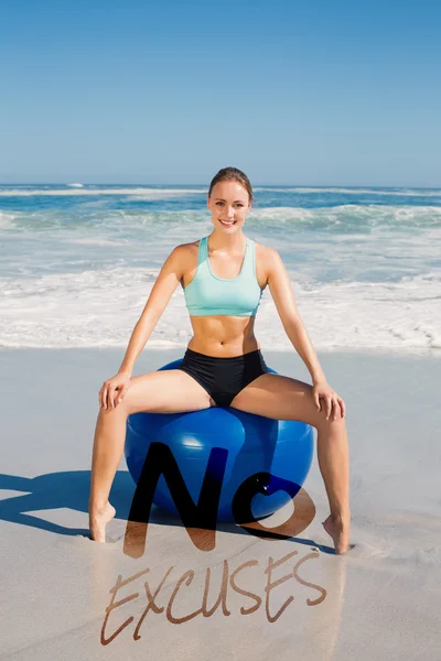 Fit woman sitting on exercise ball — Stock Photo, Image