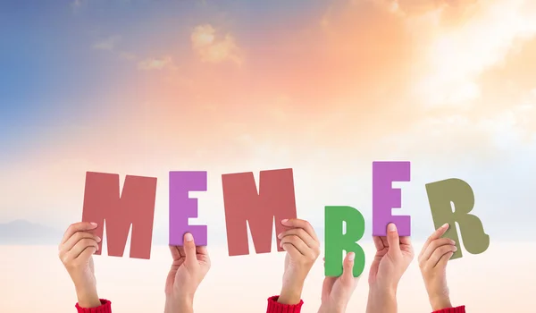 Composite image of hands holding up member — Stock Photo, Image