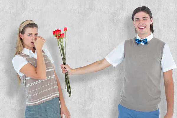 Geeky hipster offering red roses to his girlf — Stock Photo, Image