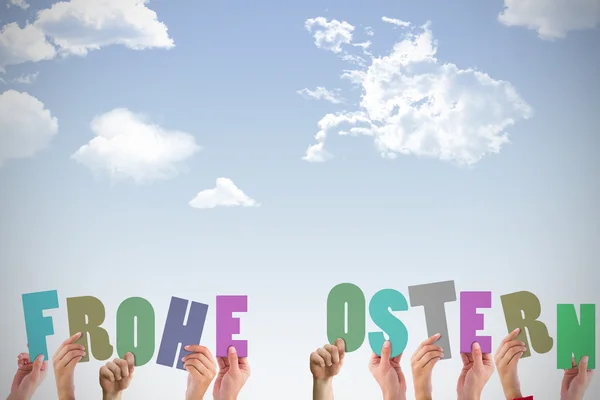 Hands holding up frohe ostern — Stock Photo, Image